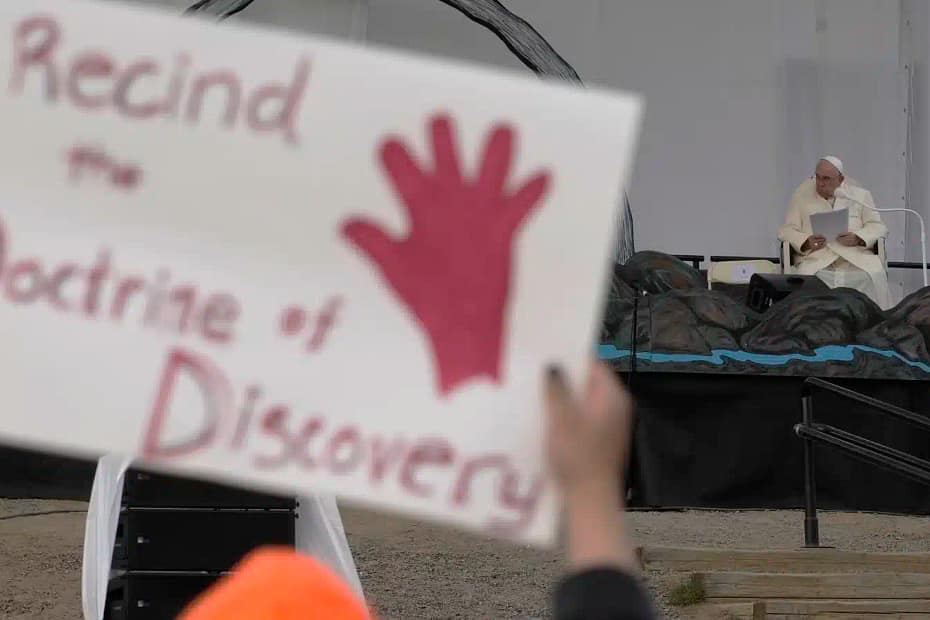 People protest as Pope Francis meets young people and elders at Nakasuk Elementary School Square in Iqaluit, Canada, last July. The Vatican on Thursday formally repudiated the "Doctrine of Discovery." The theory is backed by 15th century papal decrees that legitimized the colonial-era seizure of Native lands and form the basis of some property laws today. Gregorio Borgia/AP